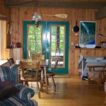 Open concept living area. French doors to screened room.