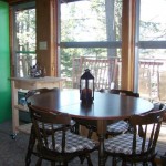 Dining room table looks out over lake. Seats 6.