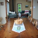 Dine with a view of the lake. Pine table comfortably seats 10. Dine with a view of the lake. Pine table comfortably seats 10.