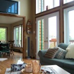 Big screen TV and surround sound entertainment centre. French doors lead to wrap-around deck. Big screen TV and surround sound entertainment centre. French doors lead to wrap-around deck.