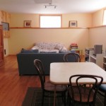 Finished basement and rec room with Entertainment center. Wood table and chairs in far corner for extra dining space. Finished basement and rec room with Entertainment center. Wood table and chairs in far corner for extra dining space.