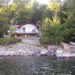 This bright and beautiful 3 bedroom cottage is right on the water with a stunning island vista on prestigious Kennisis Lake. This bright and beautiful 3 bedroom cottage is right on the water with a stunning island vista on prestigious Kennisis Lake.