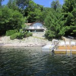This bright and beautiful 3 bedroom cottage is right on the water with a stunning island vista on prestigious Kennisis Lake. This bright and beautiful 3 bedroom cottage is right on the water with a stunning island vista on prestigious Kennisis Lake.