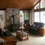 Living room looks out over spacious front deck and lake. Living room looks out over spacious front deck and lake.