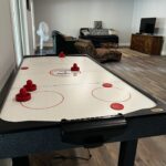 Air hockey and bean bag throw