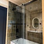 Main floor bathroom with tub and shower